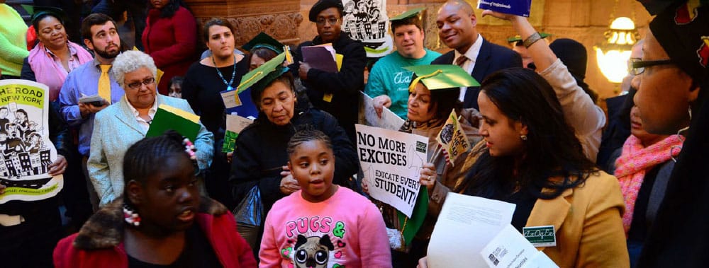 Participants at a 2013 AQE action in the state capitol building