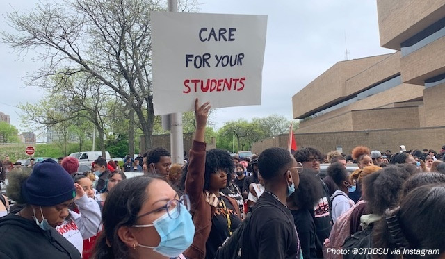Student protest with sign that reads Care For Your Students