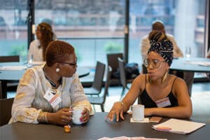 Two activists talking at a table